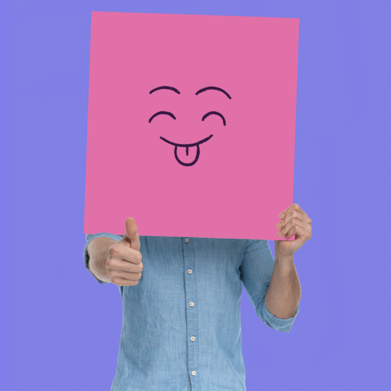 Picture of a person holding a happy face card with thumbs up to represent the applications of learning games.